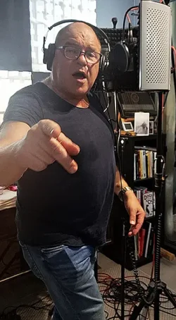 Sergio pointing towards the camera during a studio session